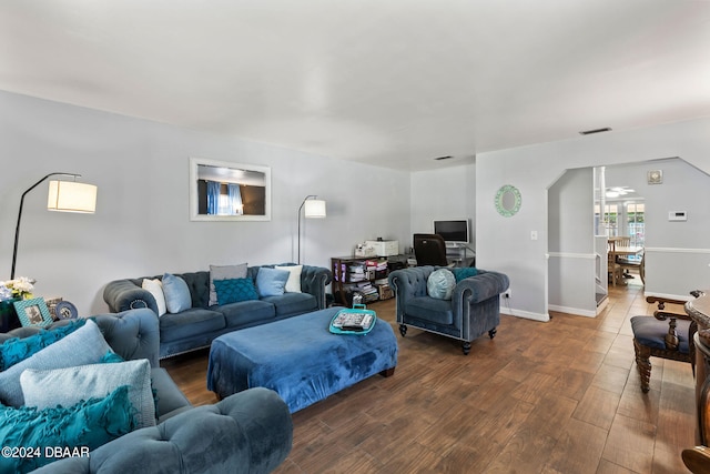 living room with dark hardwood / wood-style floors