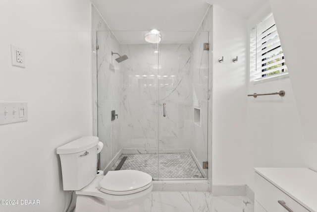 bathroom with a shower with shower door and toilet