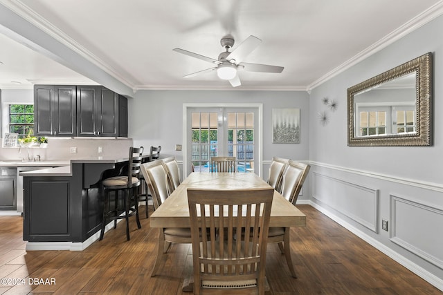 dining area with dark hardwood / wood-style flooring, ceiling fan, crown molding, and plenty of natural light