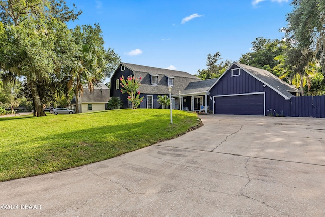 view of front of home featuring a garage and a front yard