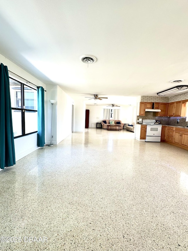 interior space featuring a ceiling fan and visible vents