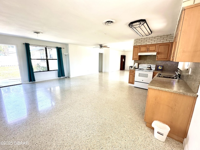 kitchen featuring a ceiling fan, visible vents, under cabinet range hood, white range with electric stovetop, and a sink