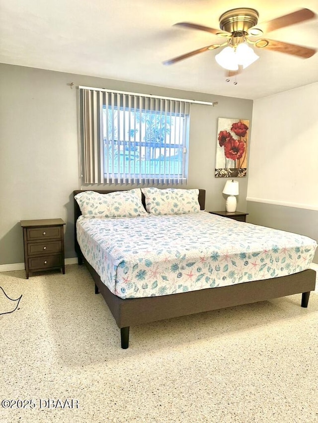 bedroom with baseboards and ceiling fan