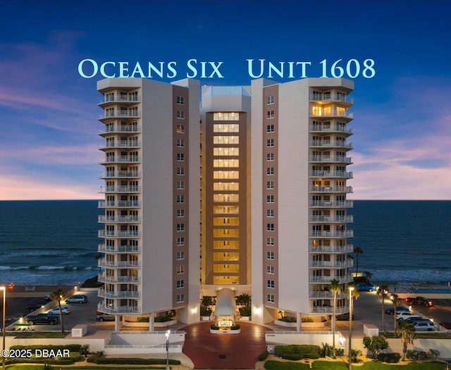 view of building exterior featuring a water view