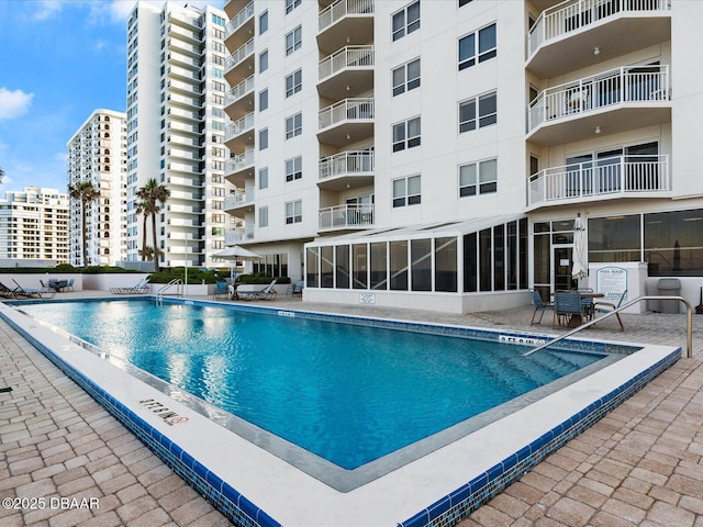 community pool featuring a patio area
