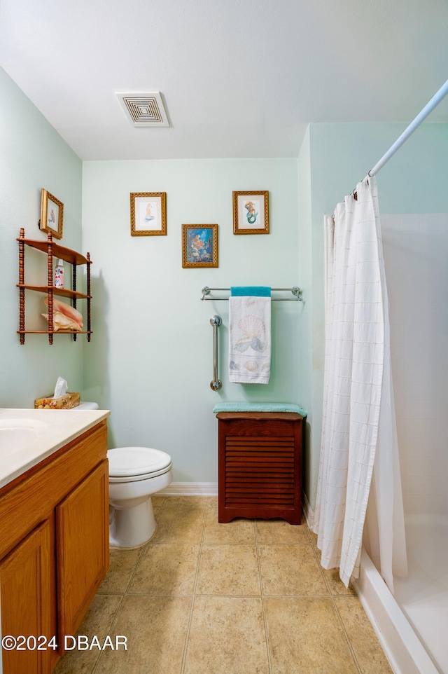 bathroom with tile patterned flooring, vanity, toilet, and a shower with curtain