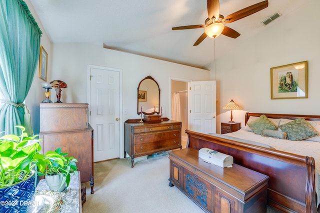 129 Rae Dr, Palm Coast, FL 32164 - bedroom featuring light colored carpet, lofted ceiling, and a ceiling fan