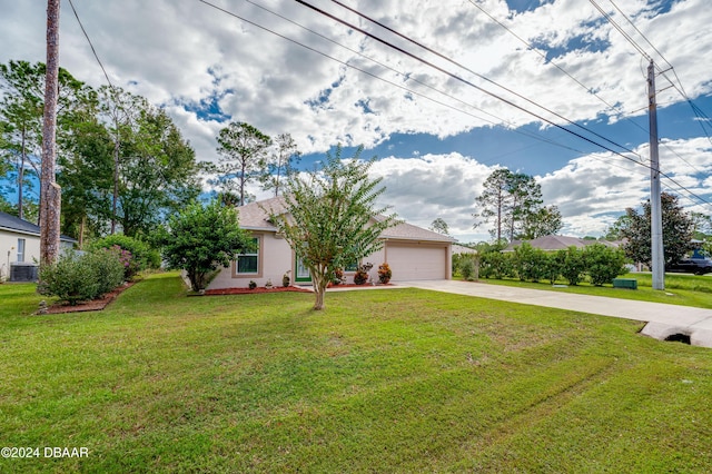 129 Rae Dr, Palm Coast, FL 32164 - view of property hidden behind natural elements featuring driveway, a front yard, a garage, and stucco siding