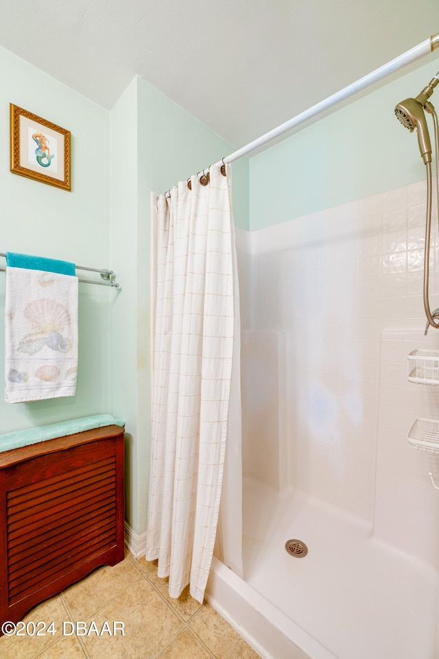 bathroom with tile patterned flooring and a shower with curtain