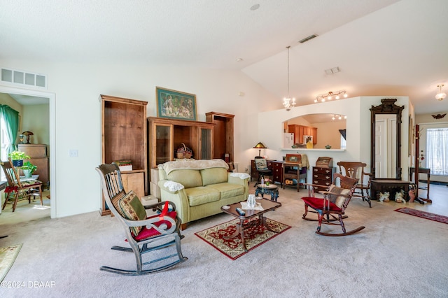 129 Rae Dr, Palm Coast, FL 32164 - carpeted living area featuring vaulted ceiling and arched walkways