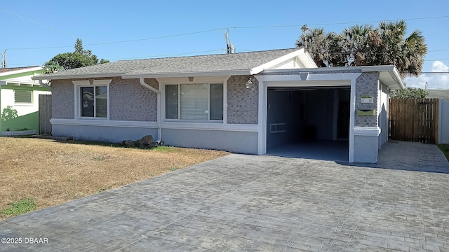 59 Margaret Rd, Ormond Beach, FL 32176 - single story home with an attached garage and decorative driveway