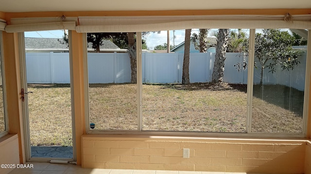 59 Margaret Rd, Ormond Beach, FL 32176 - doorway to outside featuring tile patterned flooring and plenty of natural light
