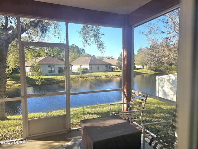 sunroom with a water view