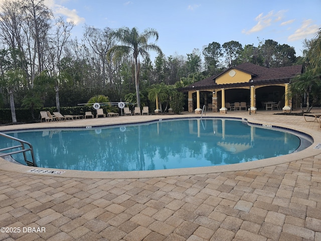 pool featuring a patio area