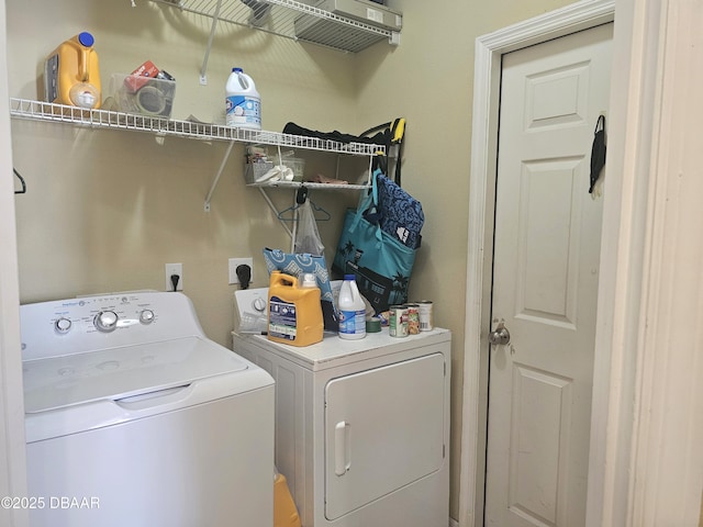 washroom with laundry area and independent washer and dryer