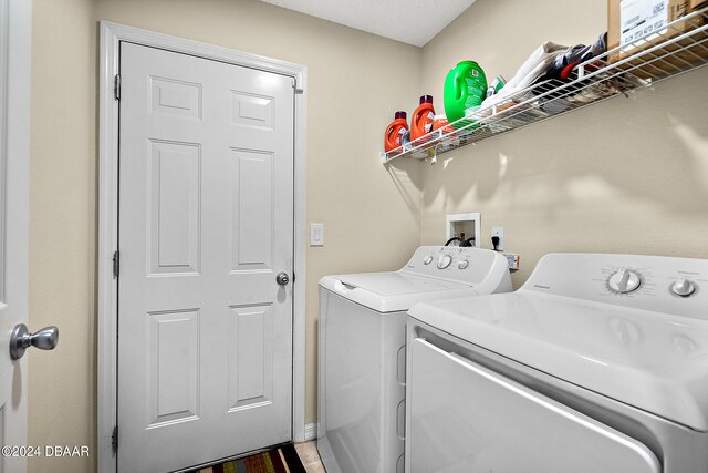 laundry room with independent washer and dryer