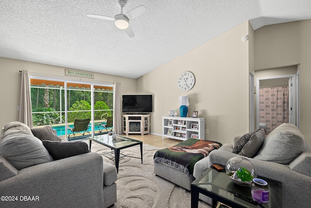 tiled living room featuring a textured ceiling and ceiling fan