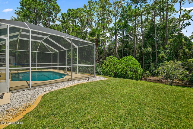 view of yard featuring glass enclosure