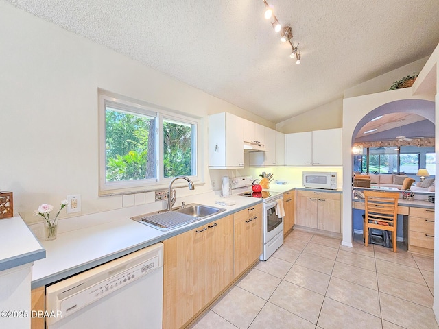900 Smokerise Blvd, Port Orange, FL 32127 - kitchen with white appliances, a sink, a textured ceiling, lofted ceiling, and light tile patterned floors