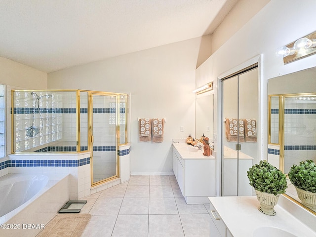 900 Smokerise Blvd, Port Orange, FL 32127 - bathroom featuring vanity, a bath, a stall shower, lofted ceiling, and tile patterned flooring