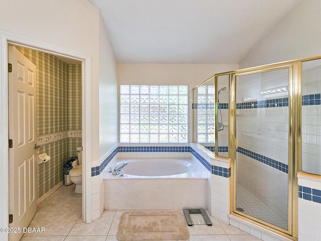 900 Smokerise Blvd, Port Orange, FL 32127 - full bathroom featuring a garden tub, tile patterned floors, toilet, a shower stall, and vaulted ceiling
