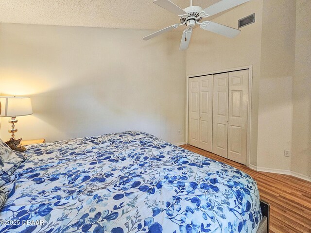 900 Smokerise Blvd, Port Orange, FL 32127 - bedroom with wood finished floors, baseboards, a ceiling fan, and a closet