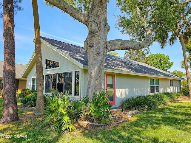 900 Smokerise Blvd, Port Orange, FL 32127 - view of front of property with a front lawn and a shingled roof