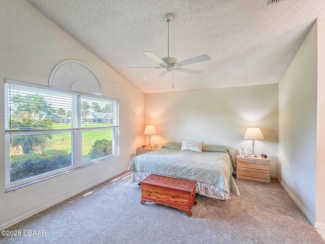 900 Smokerise Blvd, Port Orange, FL 32127 - carpeted bedroom with a textured ceiling, vaulted ceiling, baseboards, and ceiling fan