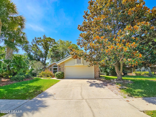 900 Smokerise Blvd, Port Orange, FL 32127 - obstructed view of property featuring brick siding, a front lawn, driveway, and a garage