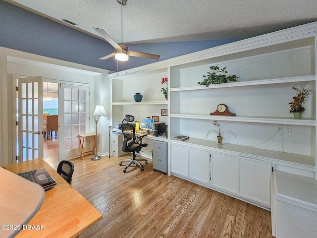 900 Smokerise Blvd, Port Orange, FL 32127 - home office with a ceiling fan, french doors, a textured ceiling, light wood-type flooring, and built in shelves