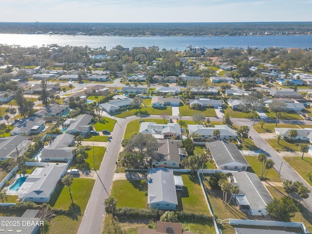 birds eye view of property with a water view and a residential view