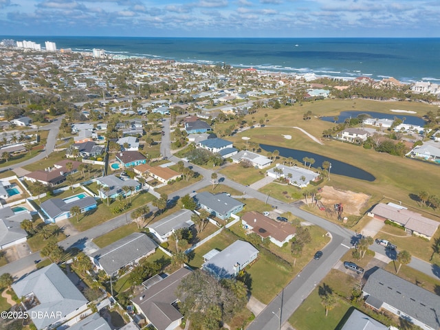 birds eye view of property with a water view and a residential view