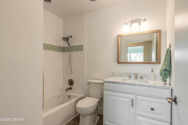 bathroom with visible vents, bathing tub / shower combination, toilet, and vanity