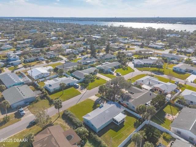 bird's eye view featuring a water view and a residential view