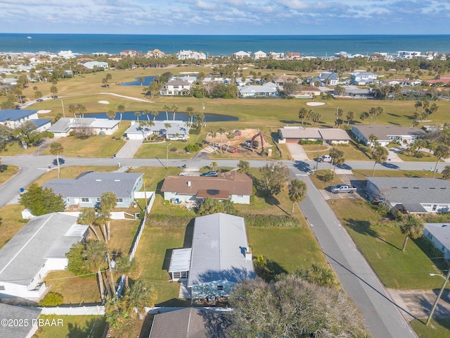 drone / aerial view featuring a residential view and a water view