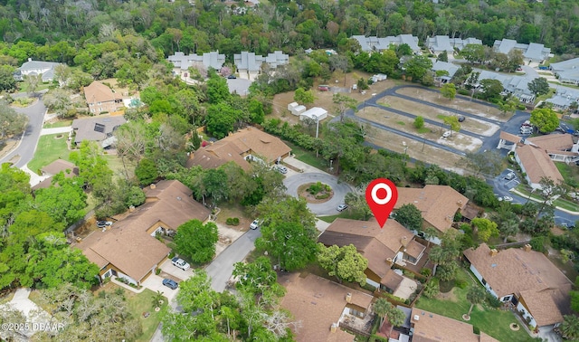birds eye view of property with a residential view