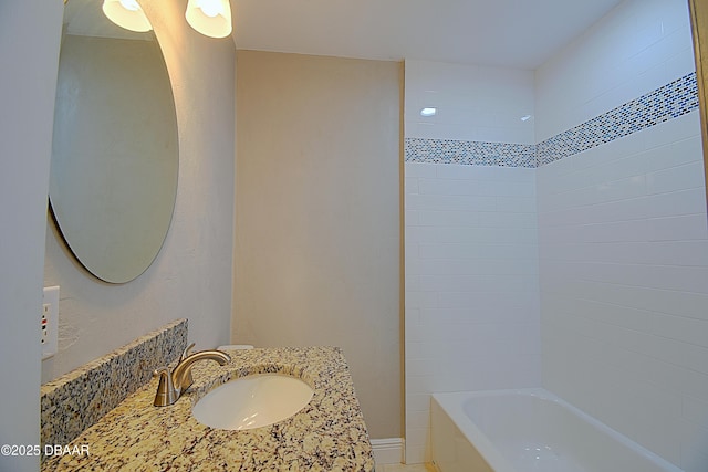 full bath featuring shower / bathing tub combination, vanity, and baseboards