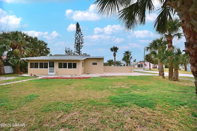 exterior space featuring a front lawn