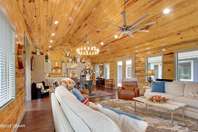 living room featuring high vaulted ceiling, dark hardwood / wood-style floors, wooden ceiling, and wooden walls