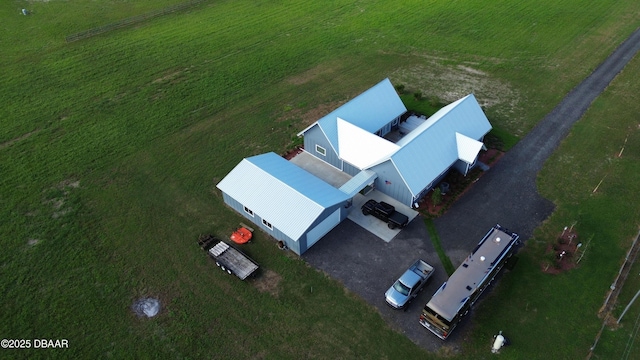 birds eye view of property featuring a rural view