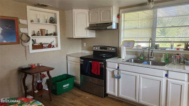 kitchen with stainless steel electric stove, sink, white cabinets, and dark hardwood / wood-style flooring