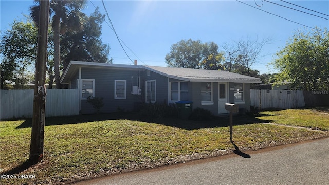 ranch-style house featuring a front lawn