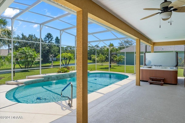 view of pool with ceiling fan, glass enclosure, a yard, a patio, and a hot tub