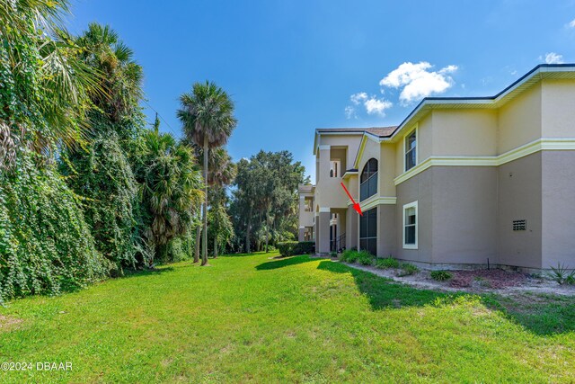 940 Village Trl Unit 6-102, Port Orange, FL 32127 - view of grassy yard