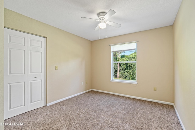 940 Village Trl Unit 6-102, Port Orange, FL 32127 - unfurnished room featuring a ceiling fan, carpet floors, and baseboards