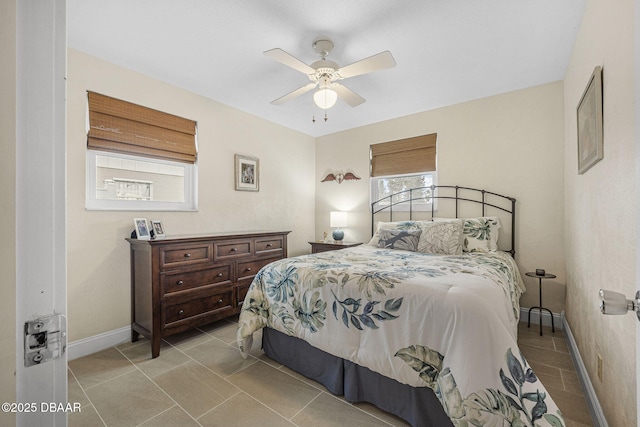 tiled bedroom with ceiling fan