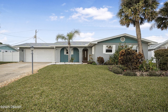 single story home featuring a garage and a front lawn