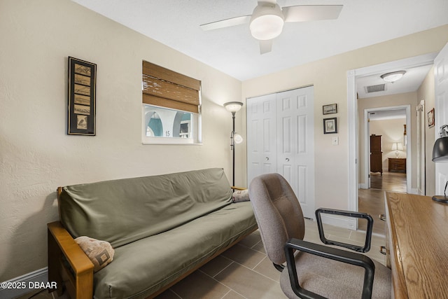 office area featuring ceiling fan and tile patterned floors