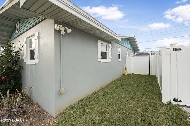 view of home's exterior with a yard