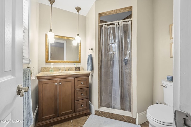 bathroom featuring vanity, a shower with shower curtain, and toilet